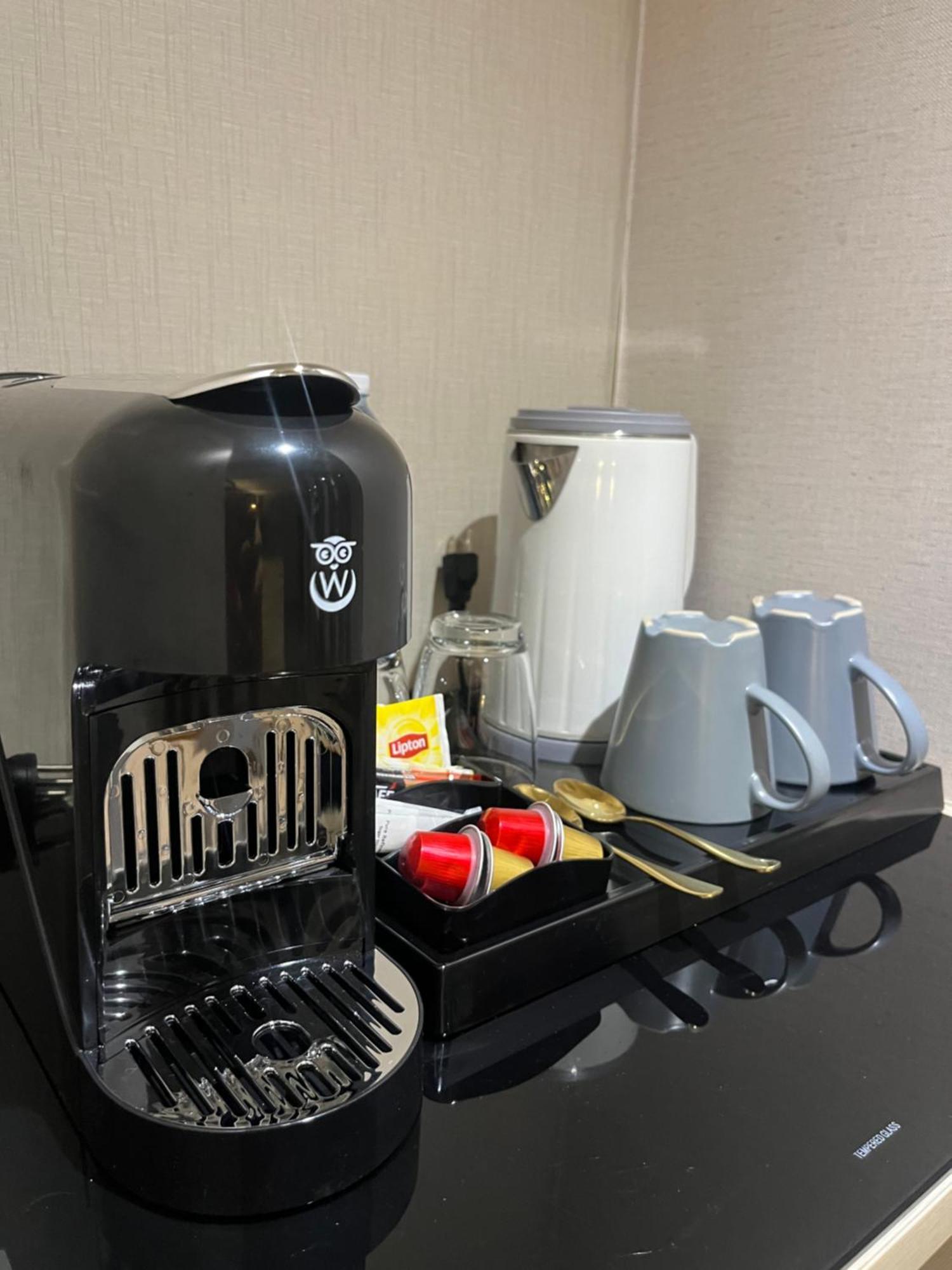Zenseana Resort & Spa - Sha Plus Patong Eksteriør billede A coffee machine in a hotel room
